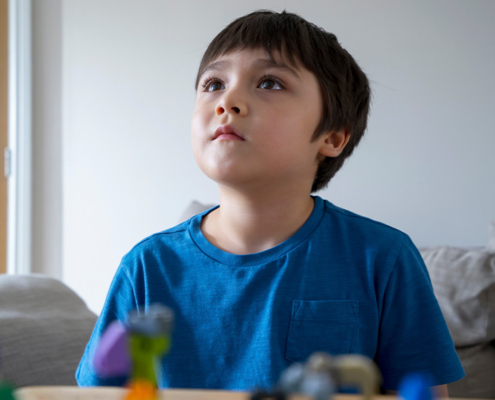 How Long Does It Take to Get Diagnosed with Autism, image of a young kid looking up.
