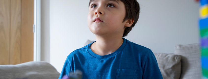 How Long Does It Take to Get Diagnosed with Autism, image of a young kid looking up.
