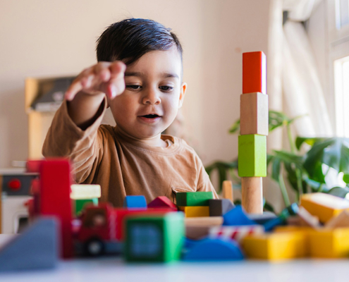 Signs of a Learning Disability in a 3-Year-Old, image of a 3 year old playing with blocks.