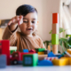 Signs of a Learning Disability in a 3-Year-Old, image of a 3 year old playing with blocks.